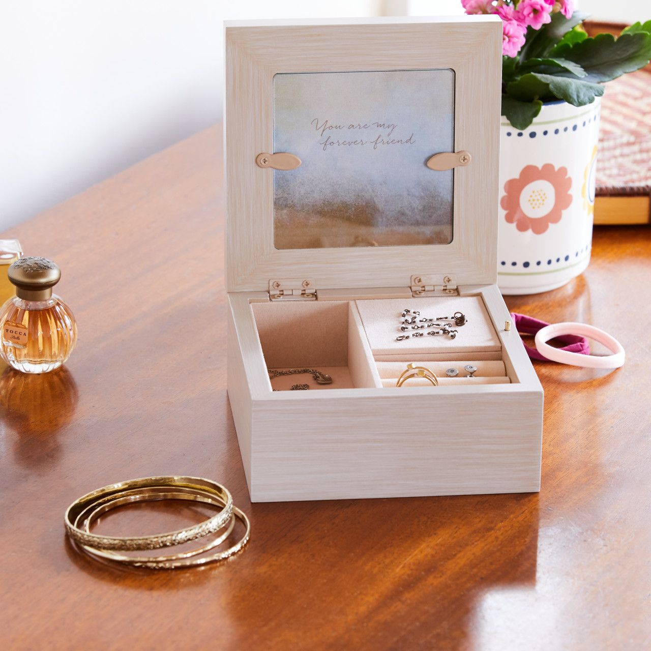 Keepsake boxes are small, sweet places to keep treasures. Give this to a friend to show your everlasting friendship with the magical touch of this also being a music box. With three different compartments this is a great gift to keep their special jewels safe.