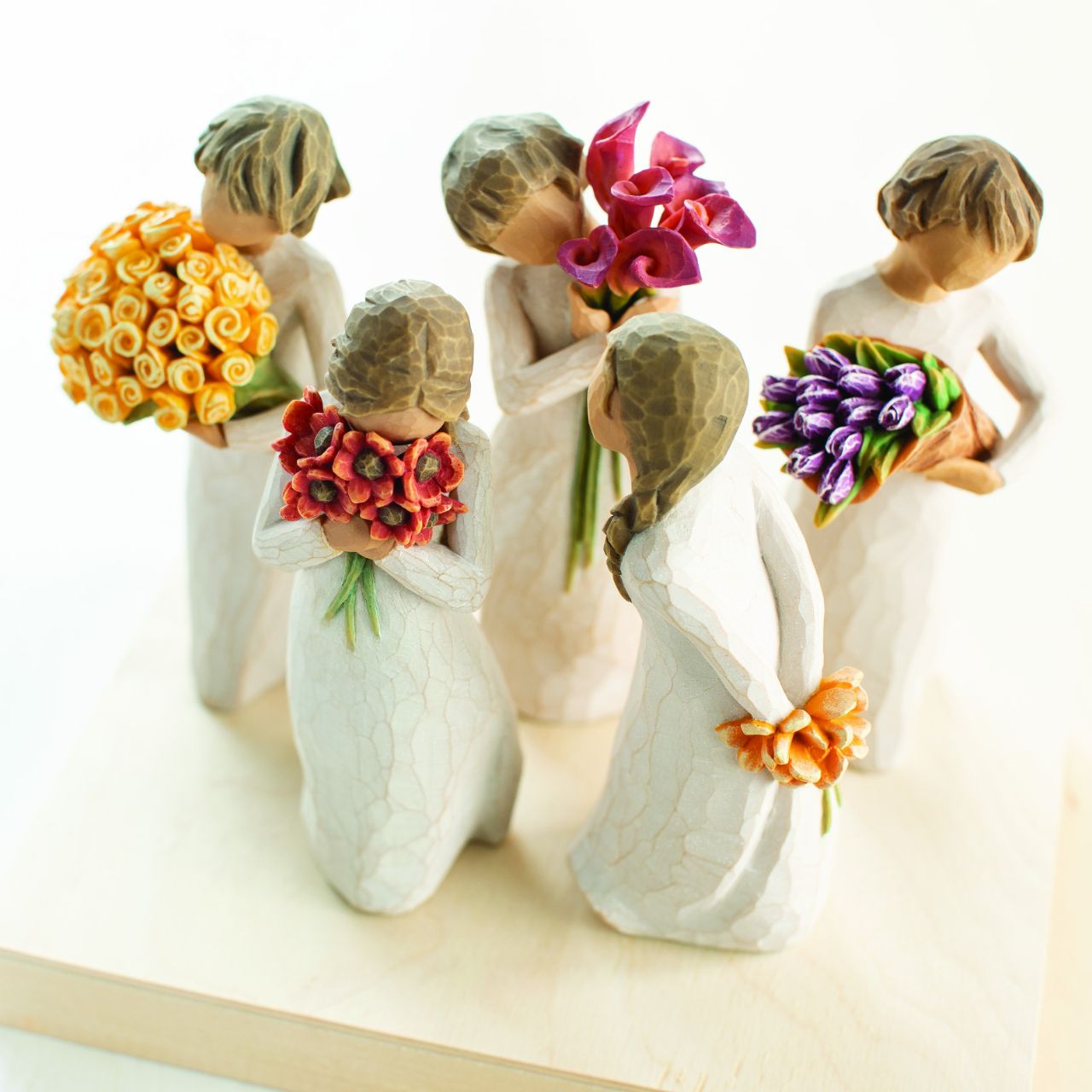 Surprise by Willow Tree Willow Tree is an intimate line of figurative sculptures representing sentiments of love, closeness, healing, courage, hope...all the emotions we encounter in life. "When tulips bloom, they're such a delightful surprise - a harbinger of spring... of longer days, sunshine, outdoor activity, new beginnings and refreshing changes.