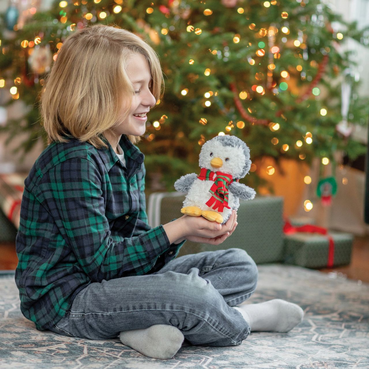 Introducing Winston Waddlekins from Boyds Bears, a delightful addition to your seasonal offerings. This charming penguin, complete with a festive scarf, promises to enchant customers of all ages.