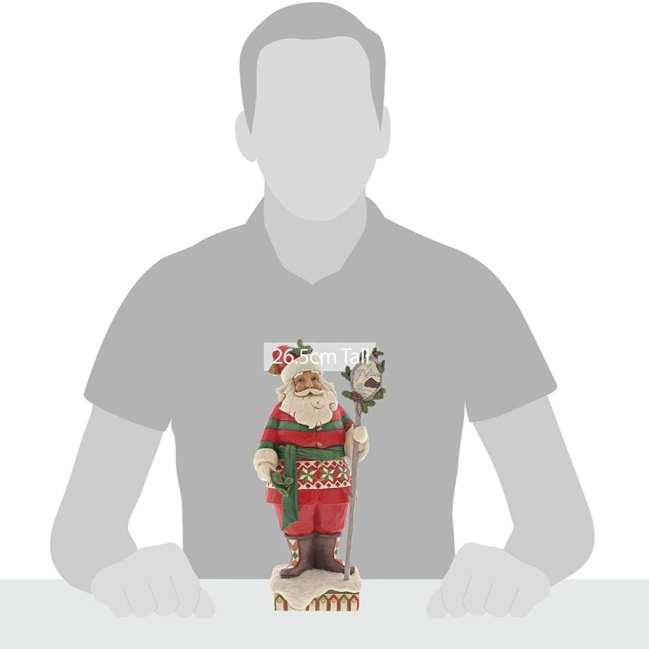 Heartwood Creek Wonder in the Wilderness - Woodsy Santa by Jim Shore The delight is in the details with this handcrafted Santa figurine. Intricate quilt patterns and folk art motifs detail his festive red and green attire, and a closer look at the staff he holds reveals a charming winter cabin scene.