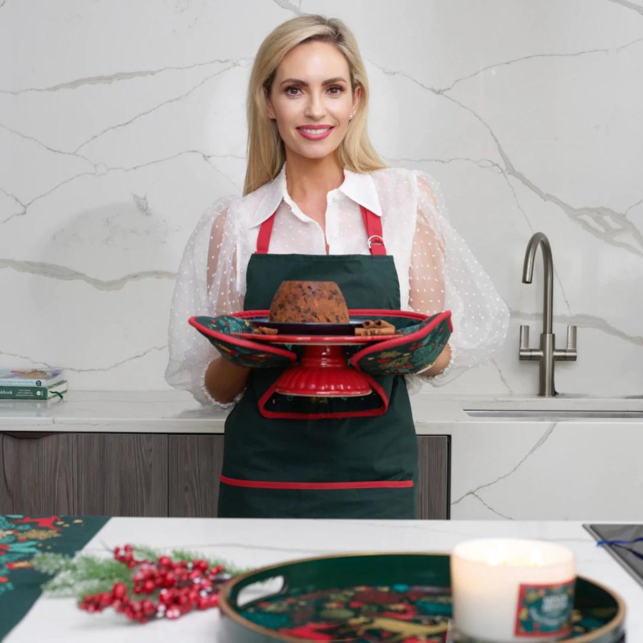 A Christmas Wish Double Oven Glove by Mindy Brownes Interiors A beautiful double oven glove finished in forest green with a Christmas design that depicts some of Christmas' key elements, such as reindeer, presents, music notes, and more. A stylish and practical way for serving those delicious festive treats straight from the oven.