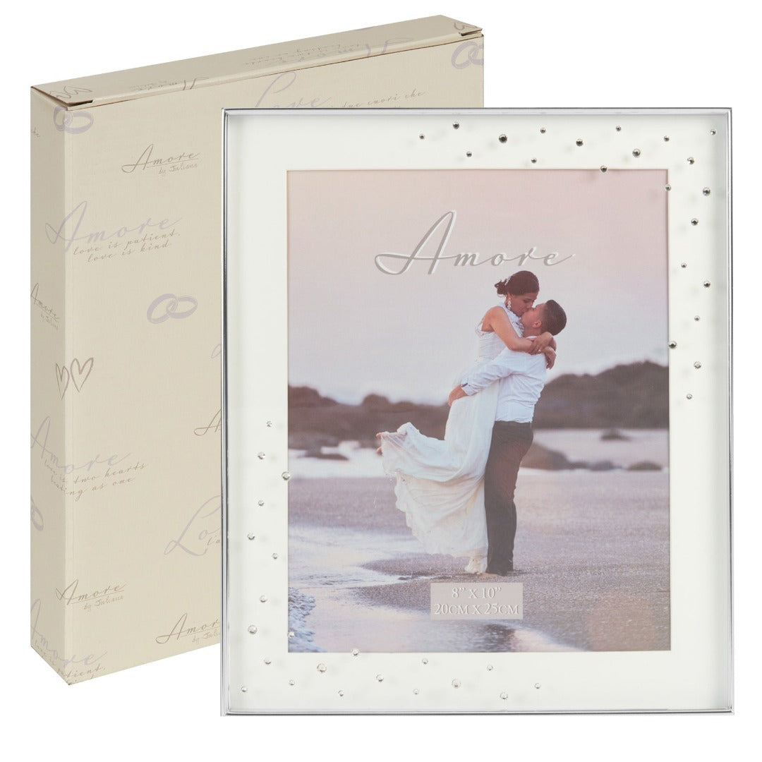 Amore Silver Plated Box Frame with Crystals 8" x 10" A beautiful silver plated box frame with 8" x 10" (20 x 25 cm) aperture from the AMORE BY JULIANA® Wedding Day Collection. The frame features a crisp white mount and the glass is embellished with a spray of crystals. Complete with standing strut.