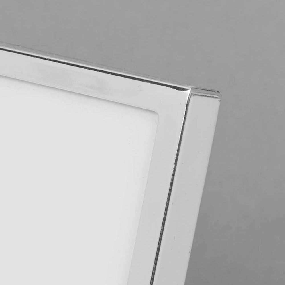 Bambino Silver Plated Photo Frame - 6" x 4" Grandchild A beautiful silver plated 6" x 4" (15x10cm) 'Grandchild' photo frame from BAMBINO BY JULIANA®. The frame features a crisp white mount, mirror 'Grandchild' title on the glass and crystal embellishments. Complete with luxury black velveteen standing strut.