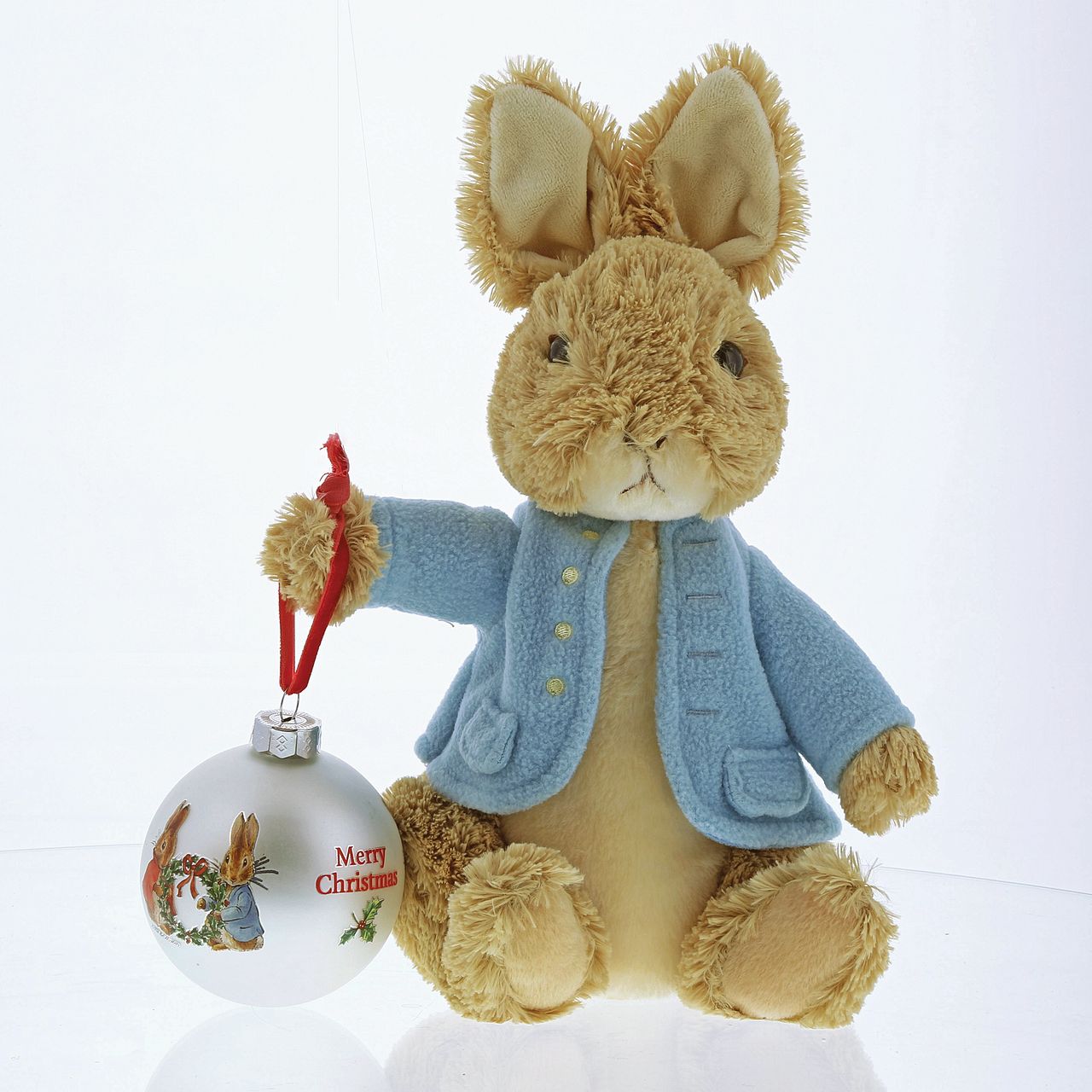 Beatrix Potter Peter Rabbit and Flopsy Holding Holly Wreath Bauble Add a touch of Beatrix Potter to your Christmas tree, with this winter collection inspired bauble. This Peter Rabbit and Flopsy Holding Holy Wreath bauble would make a heart-warming Christmas gift.