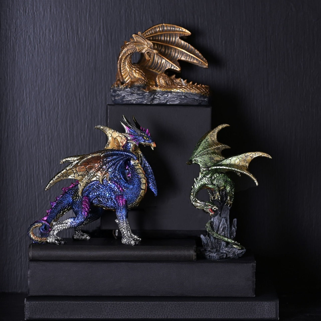Blue Dragon With Gold Wings Figurine A blue dragon with gold wings figurine by HOCUS POCUS NOVELTIES®. This majestic figurine captures the mythical world of dragons for those obsessed with fantasy.