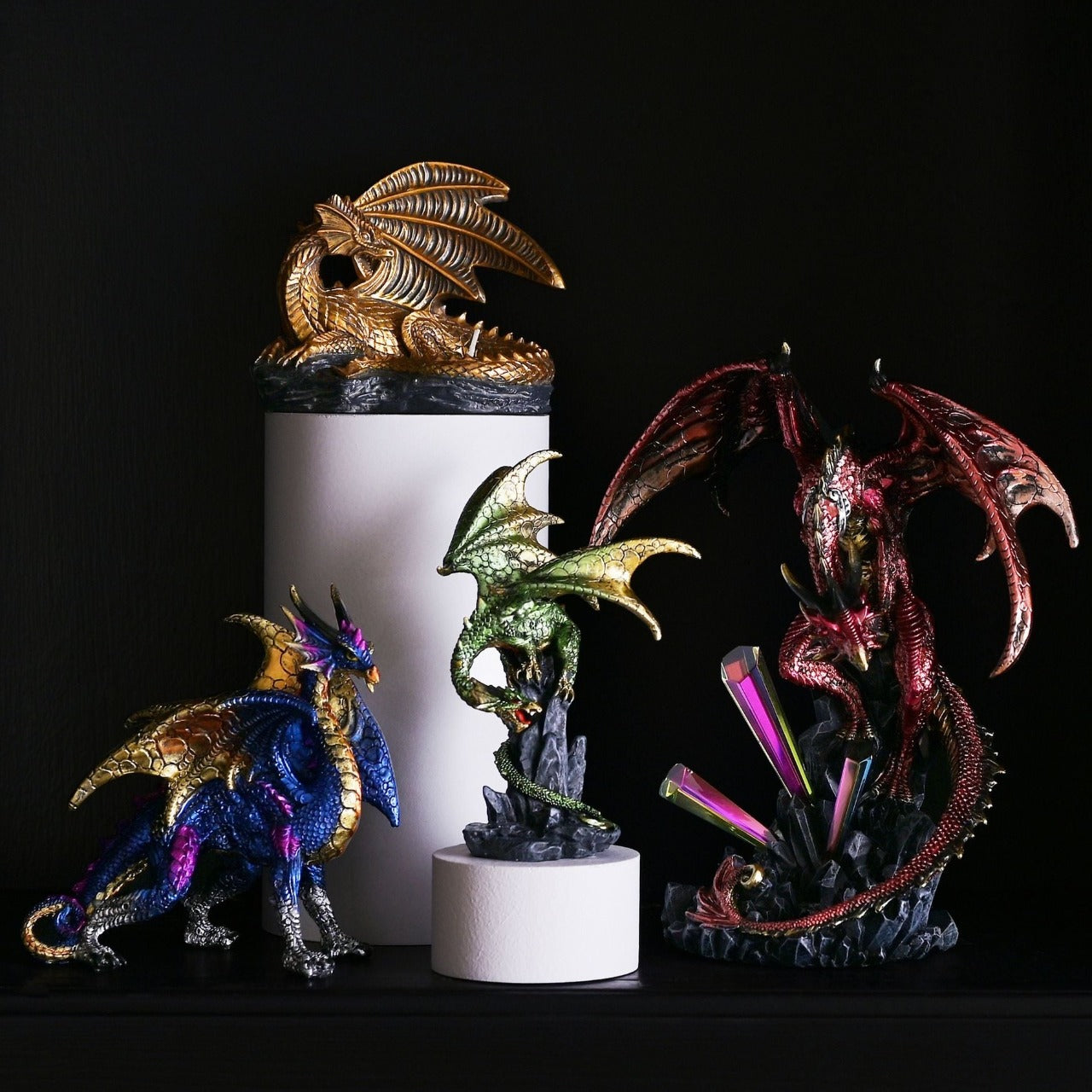 Blue Dragon With Gold Wings Figurine A blue dragon with gold wings figurine by HOCUS POCUS NOVELTIES®. This majestic figurine captures the mythical world of dragons for those obsessed with fantasy.
