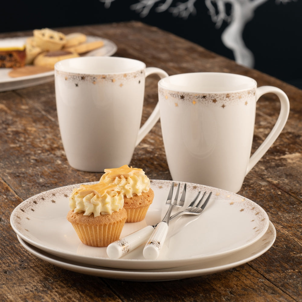 Christmas Stardust Set of 4 Tea Plates by Belleek Living Stardust features contemporary coupe shapes and a delicately stippled gold band with scattered gold accent stars adorning the edge. This set of 4 Tea Plates feature a subtle and elegant with a whimsical twist; the ideal pattern to add a bit of understated sparkle to any table for a special occasion.