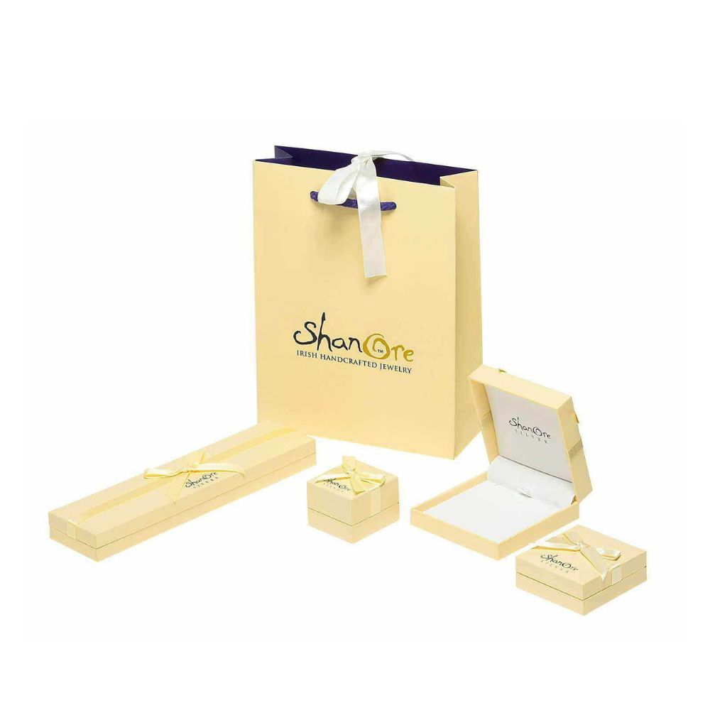 Beautifully etched with the words Love, Loyalty and friendship, this sterling silver ring is a stylish rendition of an Irish tradition. The ornate pattern includes a highly detailed set of hands, a delicate crown and a bejeweled heart. Four stones add an asymmetric, modern design to this traditional ring.