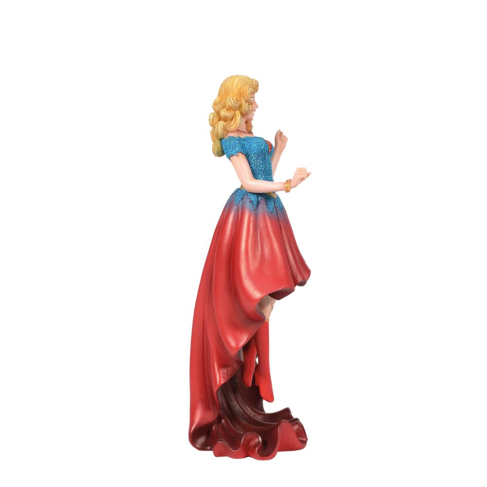 DC Comics Supergirl Couture de Force Figurine Fierce meets fabulous in this meticulously reimagined hand-crafted figure inspired by DC Comics most iconic heroines and villains. Shimmering with metallic paint accents on her flowing stylish skirt, Supergirl is midflight ready to conquer the world.