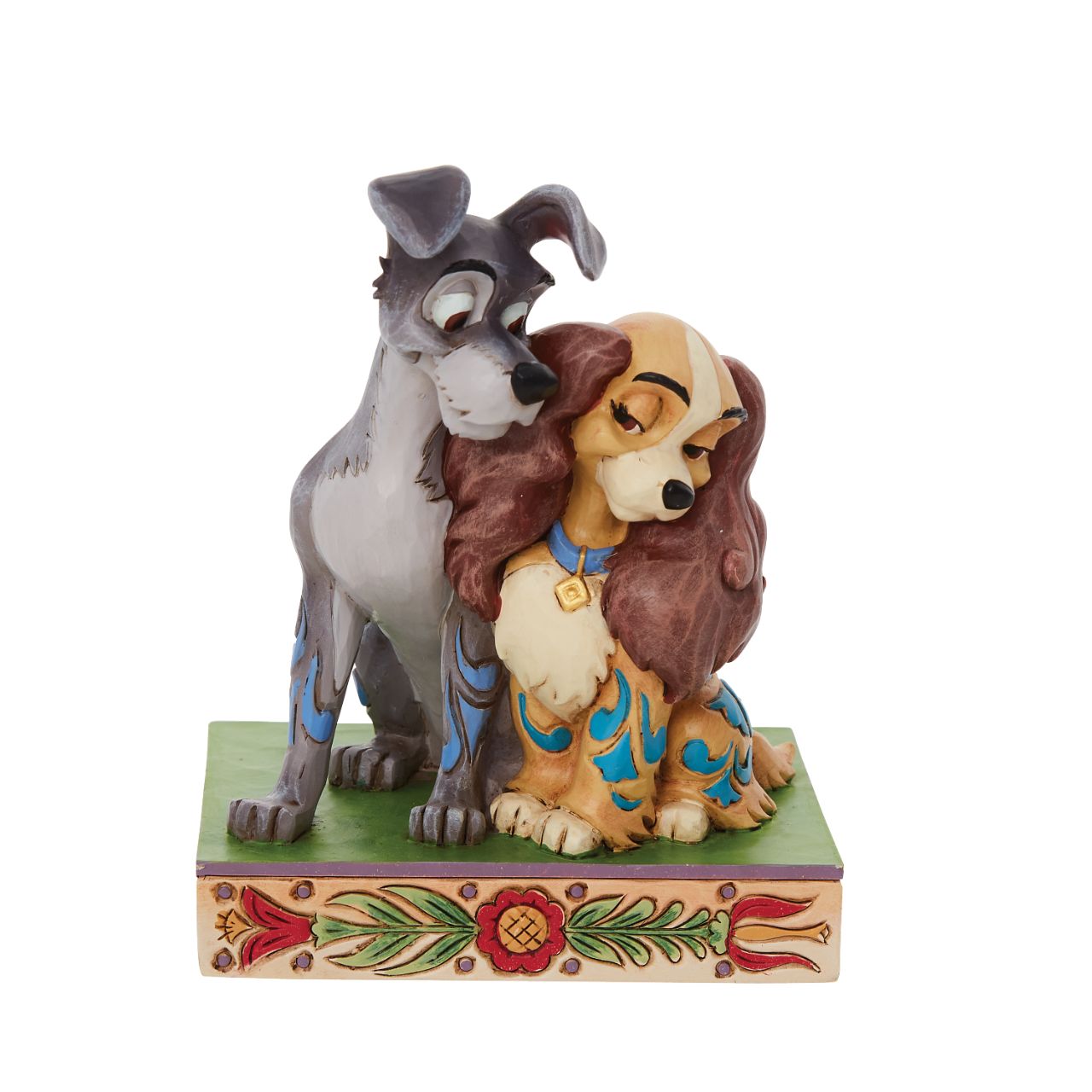 Jim Shore Disney Lady & the Tramp Love Figurine With a love story as pure as gold, this pair of precious pups snuggle together sweetly. With intricate Jim Shore rosemaling and inspiring intimacy, this Lady and the Tramp piece steals hearts. This enchanting piece is a charming addition to any room.