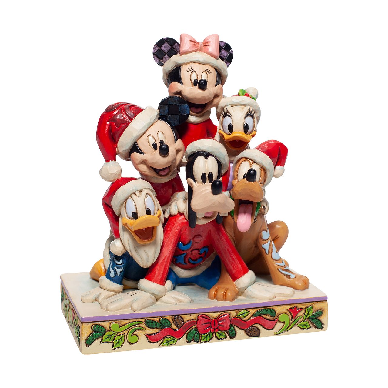 Jim Shore Christmas Mickey and Friends Stacked Figurine Stacked in a holiday pyramid, Mickey and pals savour a day in the snow. Each wearing a Santa hat, they've discovered the meaning of Christmas and enjoy jolly laughs surrounded by friends. Jim Shore creates a scene sandwiched with nostalgia and love.