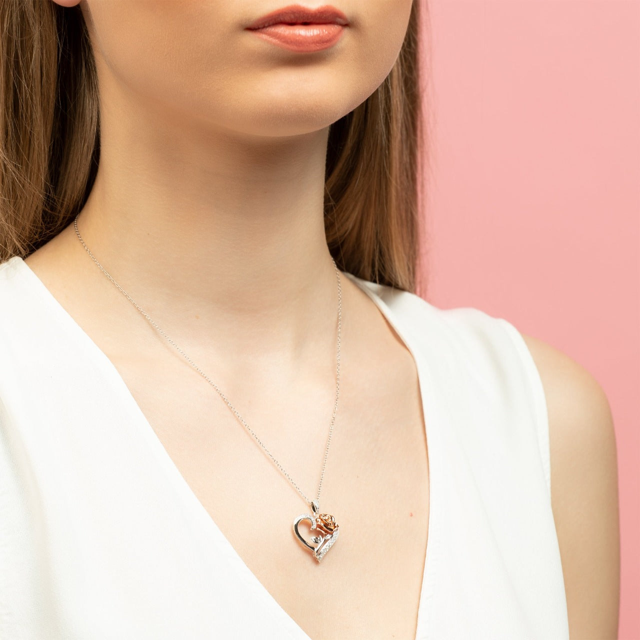 Disney Princess Silver and Rose Gold Heart with Cubic Zirconia Pendant Disney Beauty and the Beast Princess Collection, this beautiful silver and rose gold rose heart pendant necklace adding a feminine touch to the Disney classic piece of Jewellery. Trendy and fashionable design, the Disney Princess collection, sterling silver and rose gold heart pendant necklace add a chic, fun touch to any outfit.