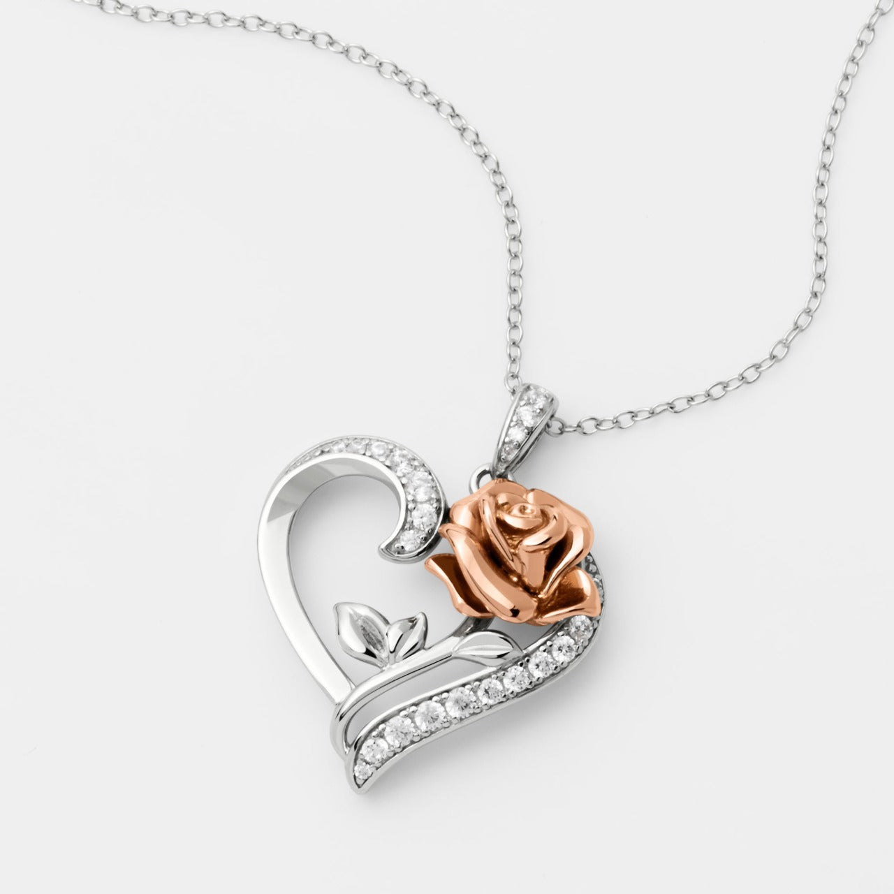 Disney Princess Silver and Rose Gold Heart with Cubic Zirconia Pendant Disney Beauty and the Beast Princess Collection, this beautiful silver and rose gold rose heart pendant necklace adding a feminine touch to the Disney classic piece of Jewellery. Trendy and fashionable design, the Disney Princess collection, sterling silver and rose gold heart pendant necklace add a chic, fun touch to any outfit.