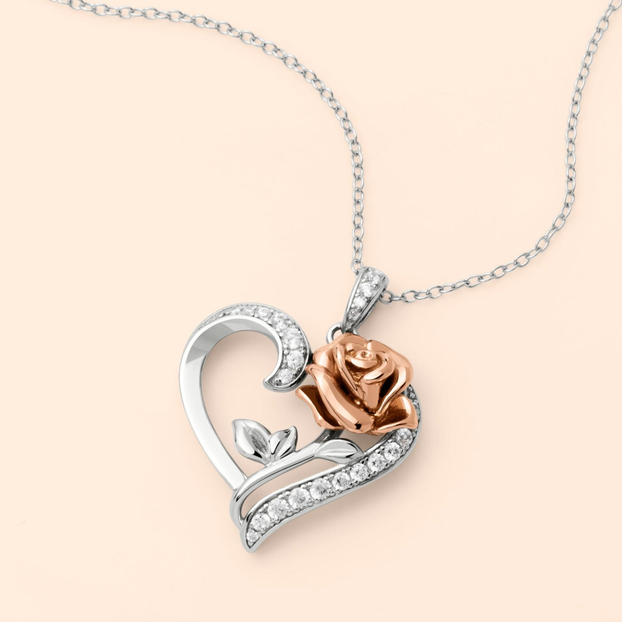 Disney Princess Silver and Rose Gold Heart with Cubic Zirconia Pendant Disney Beauty and the Beast Princess Collection, this beautiful silver and rose gold rose heart pendant necklace adding a feminine touch to the Disney classic piece of Jewellery. Trendy and fashionable design, the Disney Princess collection, sterling silver and rose gold heart pendant necklace add a chic, fun touch to any outfit.