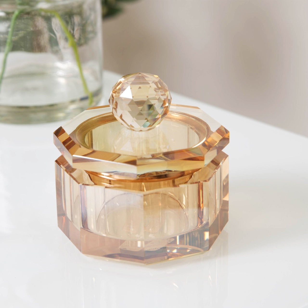 Estella Champagne Glass Trinket Box Store those bits and bobs or jewellery in style with this champagne cut glass lidded trinket box. From Estella by SOPHIA - Champagne Chic women's home and gift evoking the luxurious spirit of the art deco era.