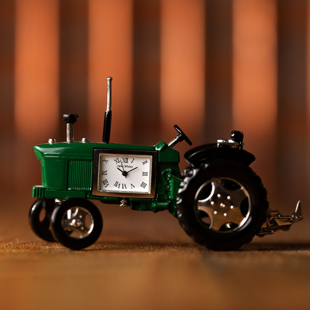 Miniature Clock Farmers Green Tractor by William Widdop Bring a unique and quirky touch to the home with this stylish miniature clock made with great attention to detail. The miniature tractor is a great gift for someone who has an interest in the farming world.