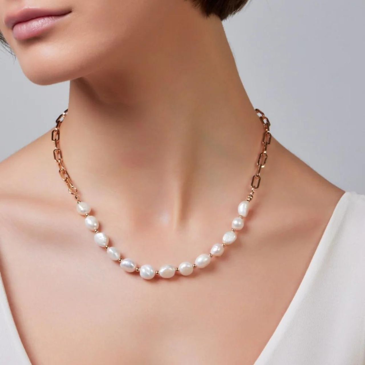 Silver Plated Freshwater Pearl & Paperclip Chain Necklace by Knight & Day The Knight & Day necklace features a silver plated chain adorned with freshwater pearls and paperclip links, resulting in a unique aesthetic.