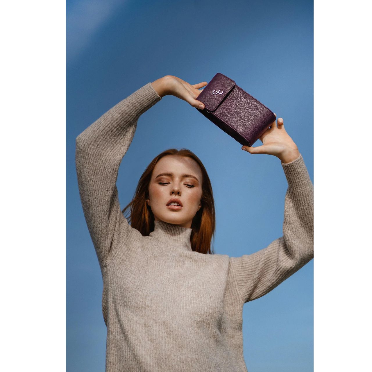 Mini Cross Body Bag - Mulberry by Galway Crystal Introducing the new must have accessory that is truly functional. Our Light weight, Slim, Sleek, Crossbody bag is designed to hold the most essential accessory: Your mobile phone. There is nothing more liberating than carrying a lightweight bag that carries your essentials