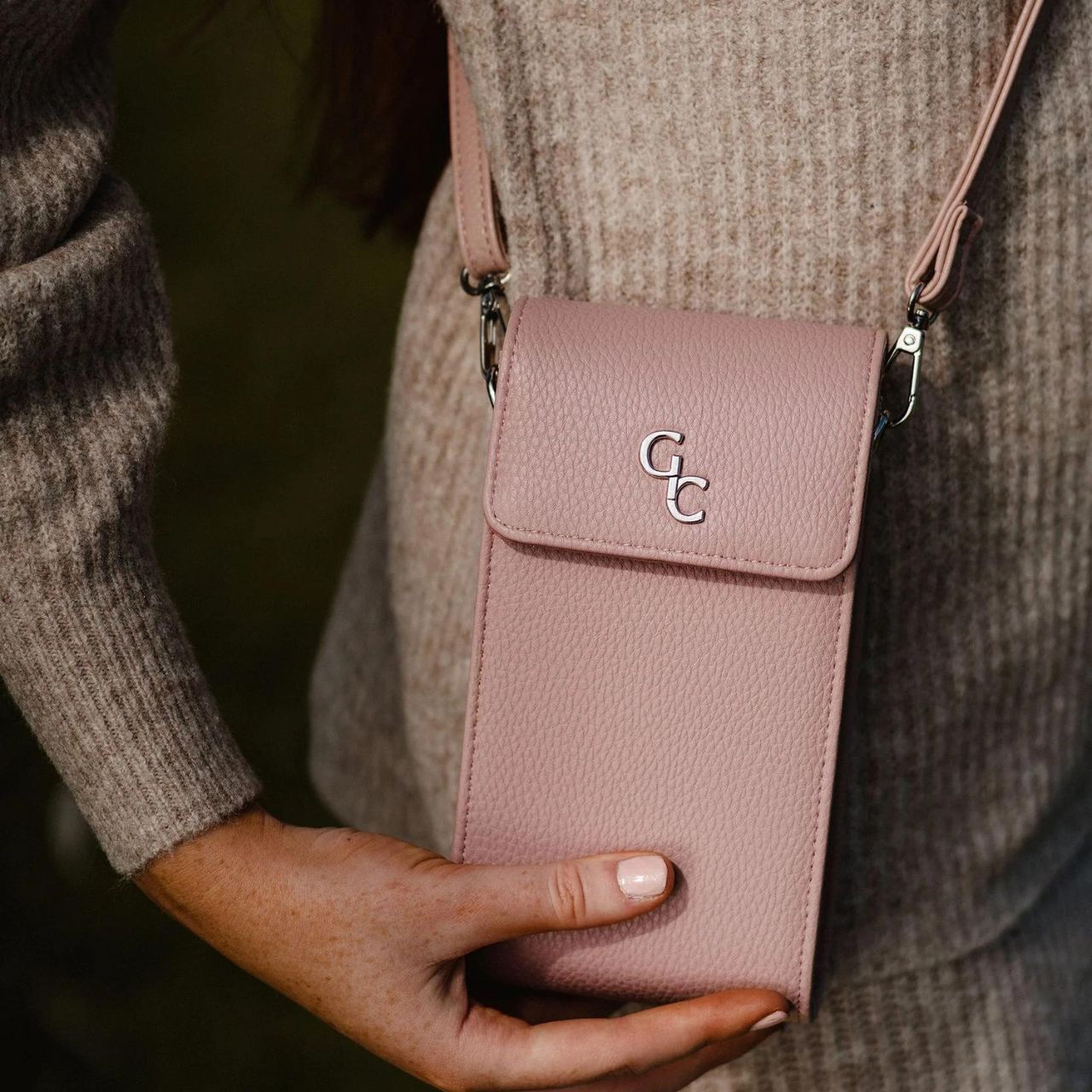 Galway Crystal Mini Cross Body Bag - Rose Pink  Introducing the new must have accessory that is truly functional. Our Light weight, Slim, Sleek, Crossbody bag is designed to hold the most essential accessory: Your mobile phone. There is nothing more liberating than carrying a lightweight bag that carries your essentials.