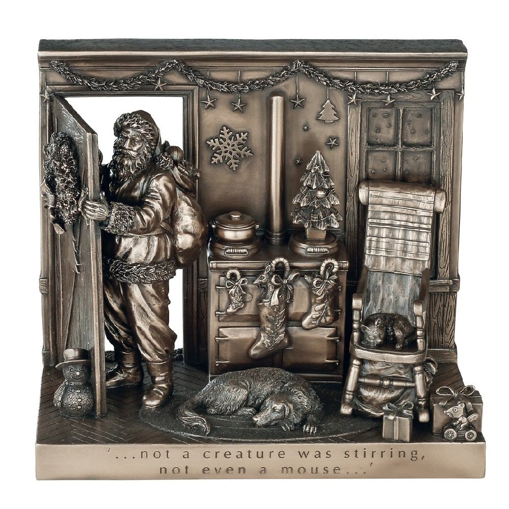 Genesis Not a Creature was Stirring Beautifully crafted in cold cast bronze, this Christmas scene incorporates Father Christmas and his bag of toys leaving the scene after filling the stockings for Christmas. The words 'Not a creature was stirring not even a mouse' crafted into the front of the scene this Christmas display would make a wonderful gift.
