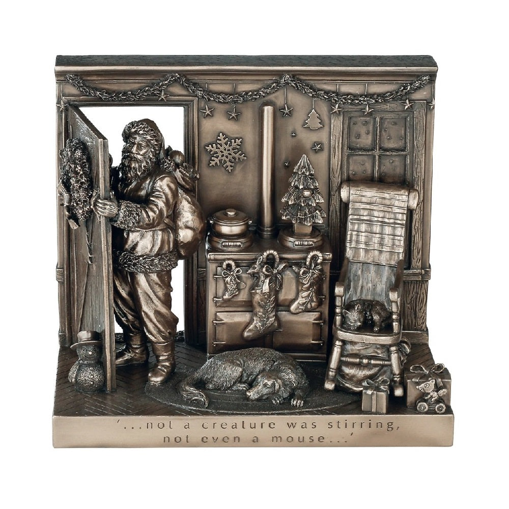 Genesis Not a Creature was Stirring Beautifully crafted in cold cast bronze, this Christmas scene incorporates Father Christmas and his bag of toys leaving the scene after filling the stockings for Christmas. The words 'Not a creature was stirring not even a mouse' crafted into the front of the scene this Christmas display would make a wonderful gift.