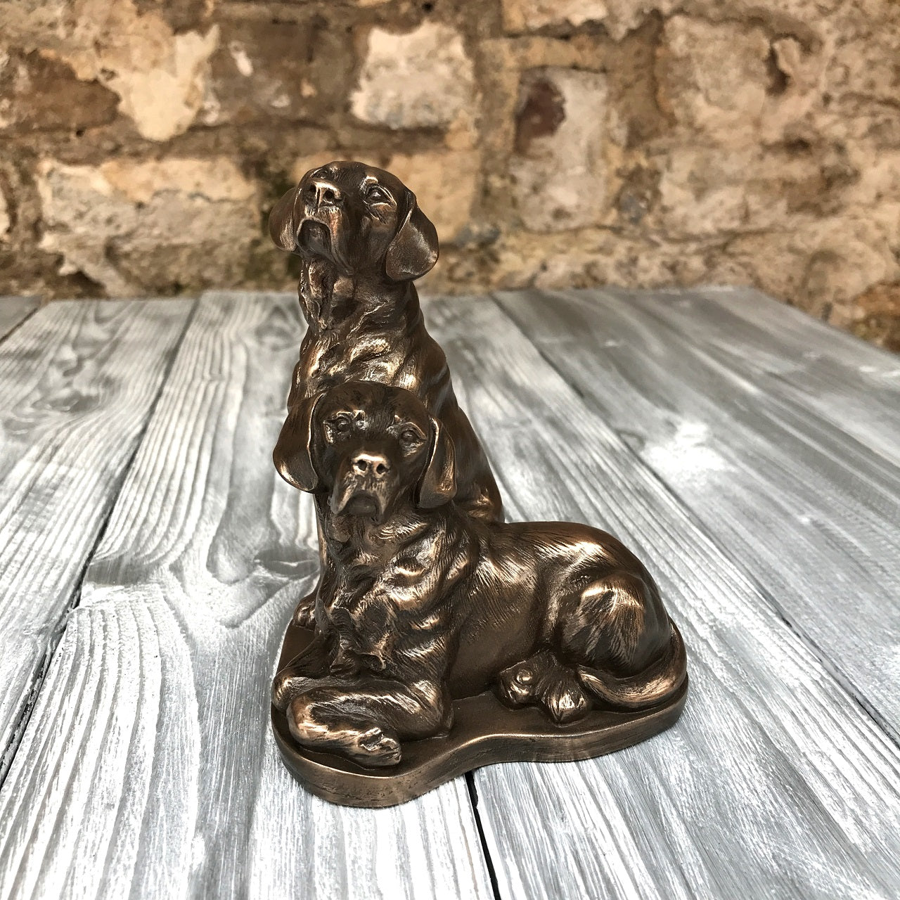 Genesis Pair of Labradors  Pair of Labradors for the dog lover.  Genesis Fine Arts has evolved into a much loved and world famous Irish brand to produce a striking range of handcrafted cold cast bronze sculptures.