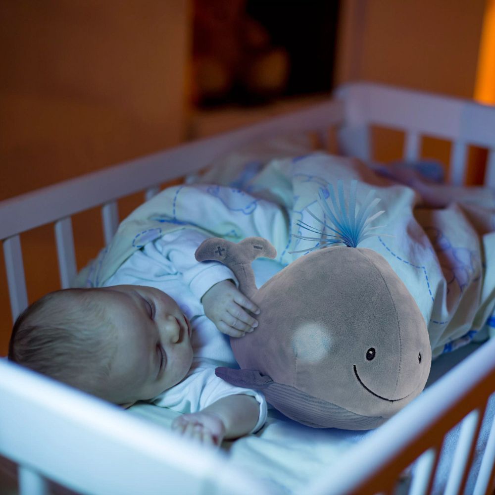 GUND Baby Sleepy Seas Light & Sound Whale  This musical plush toy will help your babies drift off to sleep. The whale is presented in an oh-so-soft light blue fabric, with blue ribbons for its hair, and dark embroidery creating a smiling face. Press the left fin and the animated whale splashes into life. Press the musical note on its right fin and the plush starts to play one of five different noises: Ocean Magic, Soothing Ocean Whale Sounds, Brahms' Lullaby, Bubbles or Ocean White Noise.