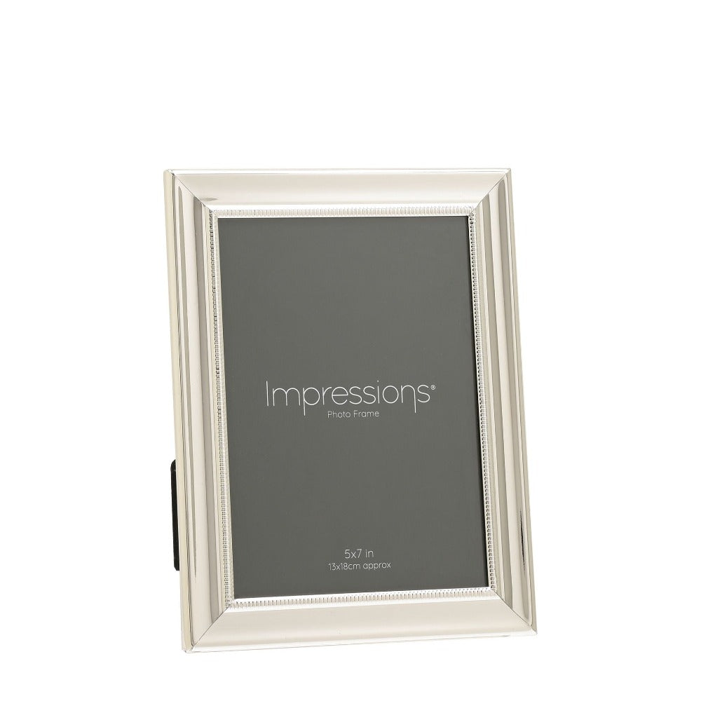 Impressions Silver-Plated Single Beaded Photo Frame 5" x 7" An elegant silver plated photo frame with scalloped edge and beaded aperture border. From IMPRESSIONS® - let your photos speak their thousands words.