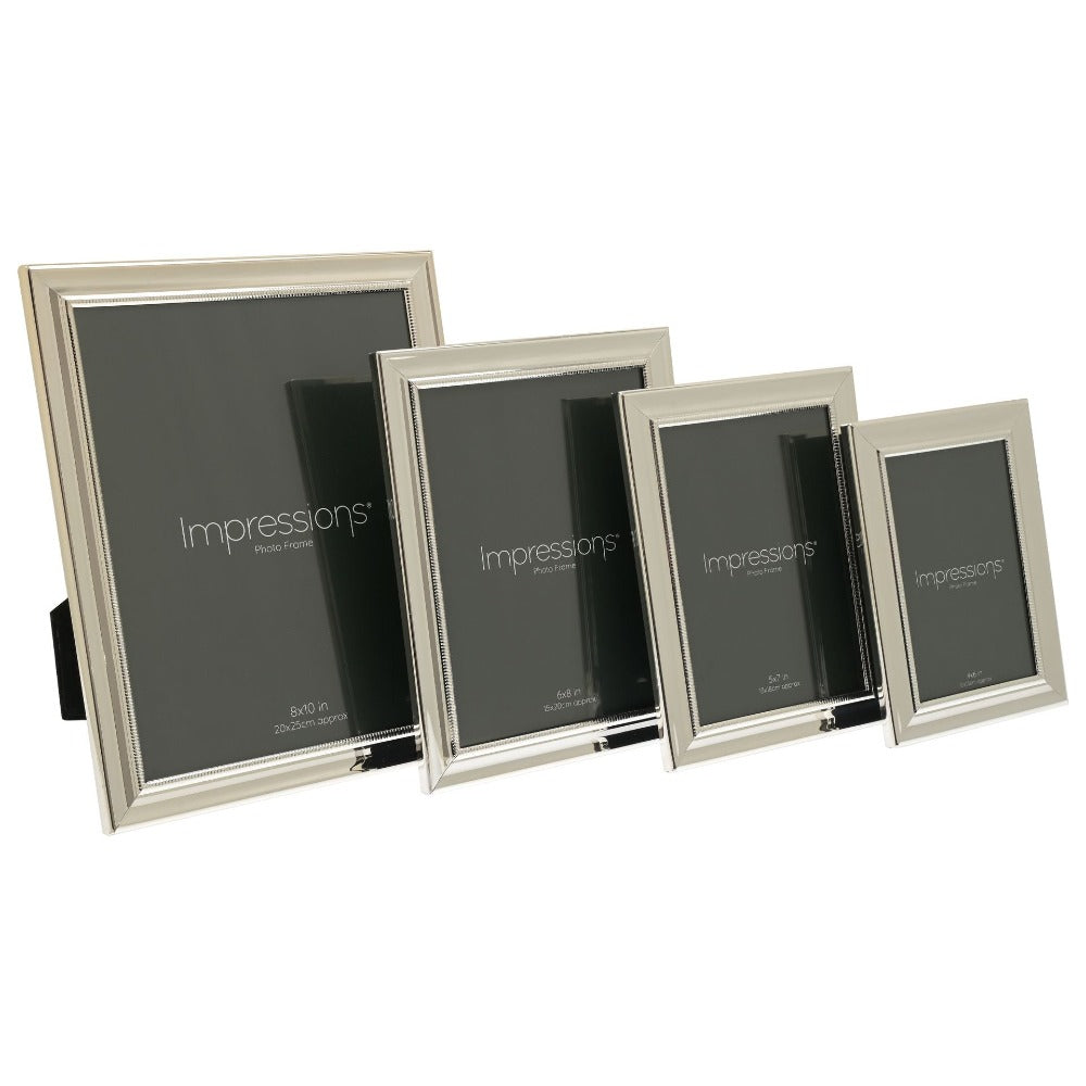 Impressions Silver-Plated Single Beaded Photo Frame 5" x 7"  An elegant silver plated photo frame with scalloped edge and beaded aperture border. From IMPRESSIONS® - let your photos speak their thousands words.