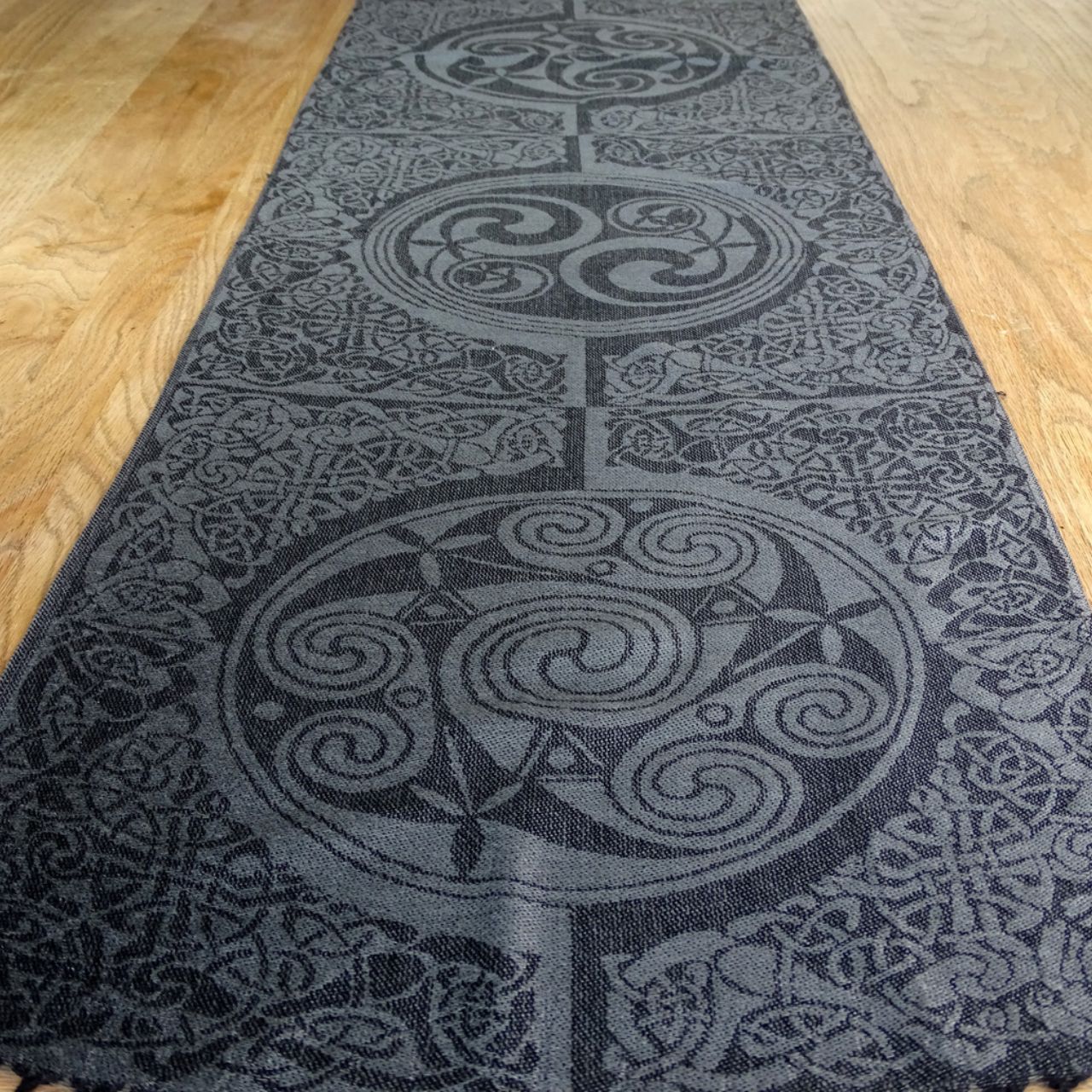 Mulligans Ireland Inishmore Celtic Pashmina Scarf  Inishmore (Árainn) is the largest of the Galway Aran Islands and is an extension of the famous limestone rocks of The Burren. The landscape of Inishmore is a patchwork of fields hemmed in by precariously balanced dry stone walls.