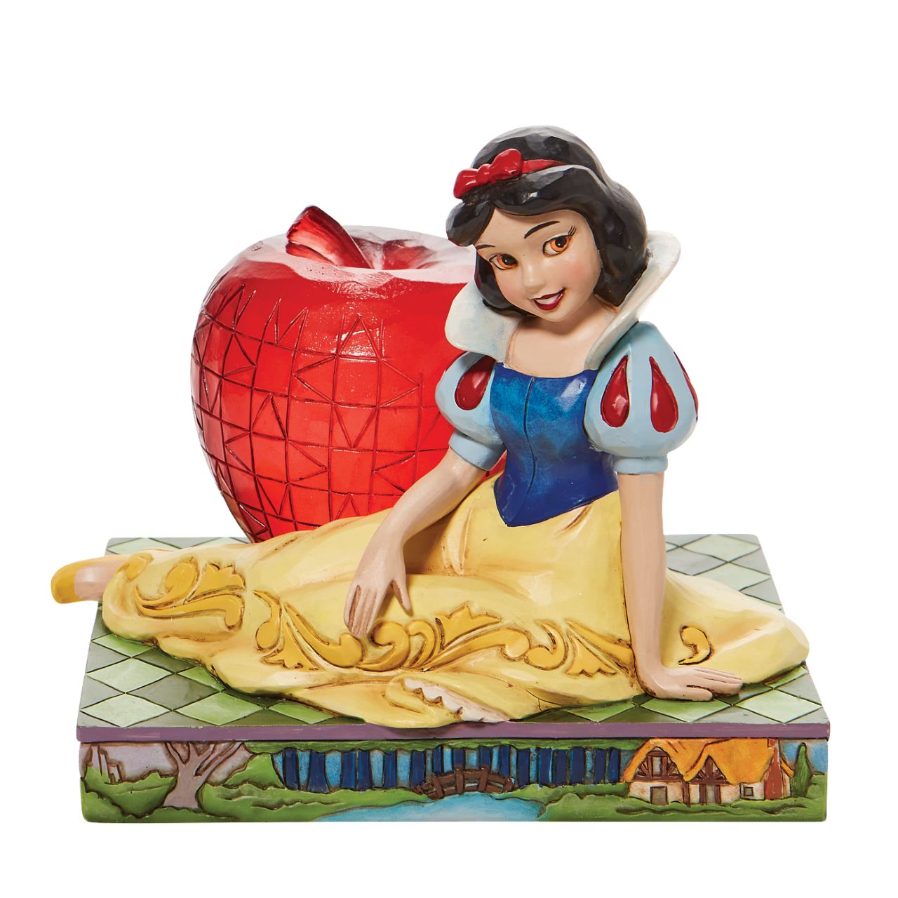 Jim Shore Disney Snow White with Apple Figurine  This Disney Traditions line by Jim Shore features iconic Walt Disney princesses with their famous props. With a base illustrating her story, this piece features Snow White in her famous gown next to a large apple. Packaged in a branded gift box.