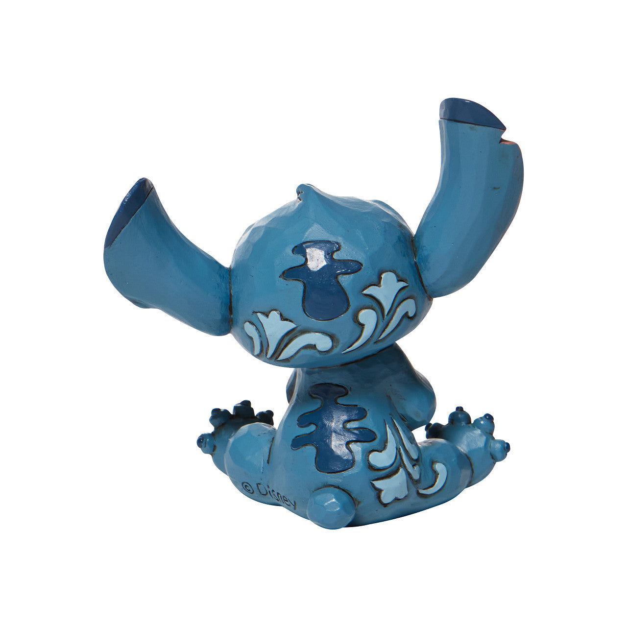 Jim Shore Stitch Mini Figurine Everyone's favorite alien, Stitch, looks extra adorable in this mini figurine by Jim Shore. Hands clasped, the temperamental alien appears soothed in this figurine, one can only imagine he's listening to Elvis records or watching Lilo hula.
