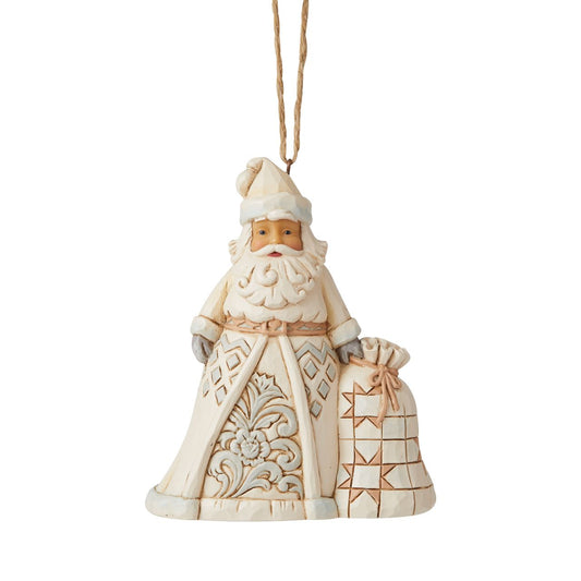 Jim Shore Heartwood Creek White Woodland Santa Hanging Ornament  In muted colors, this cool hued Santa brings grandeur with his deliveries. With a bag heavy with presents, this Christmas hero smiles happily from your tree, admiring the nice boys and girls as they open presents in your home.