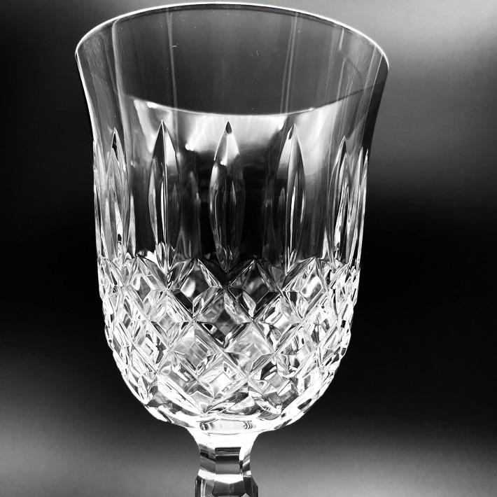 Waterford Crystal Kelsey Goblets Pair Kelsey Collection by Waterford is characterized by a simple demi-lune shape accented by an open diamond pattern and adorned with single wedge cuts.