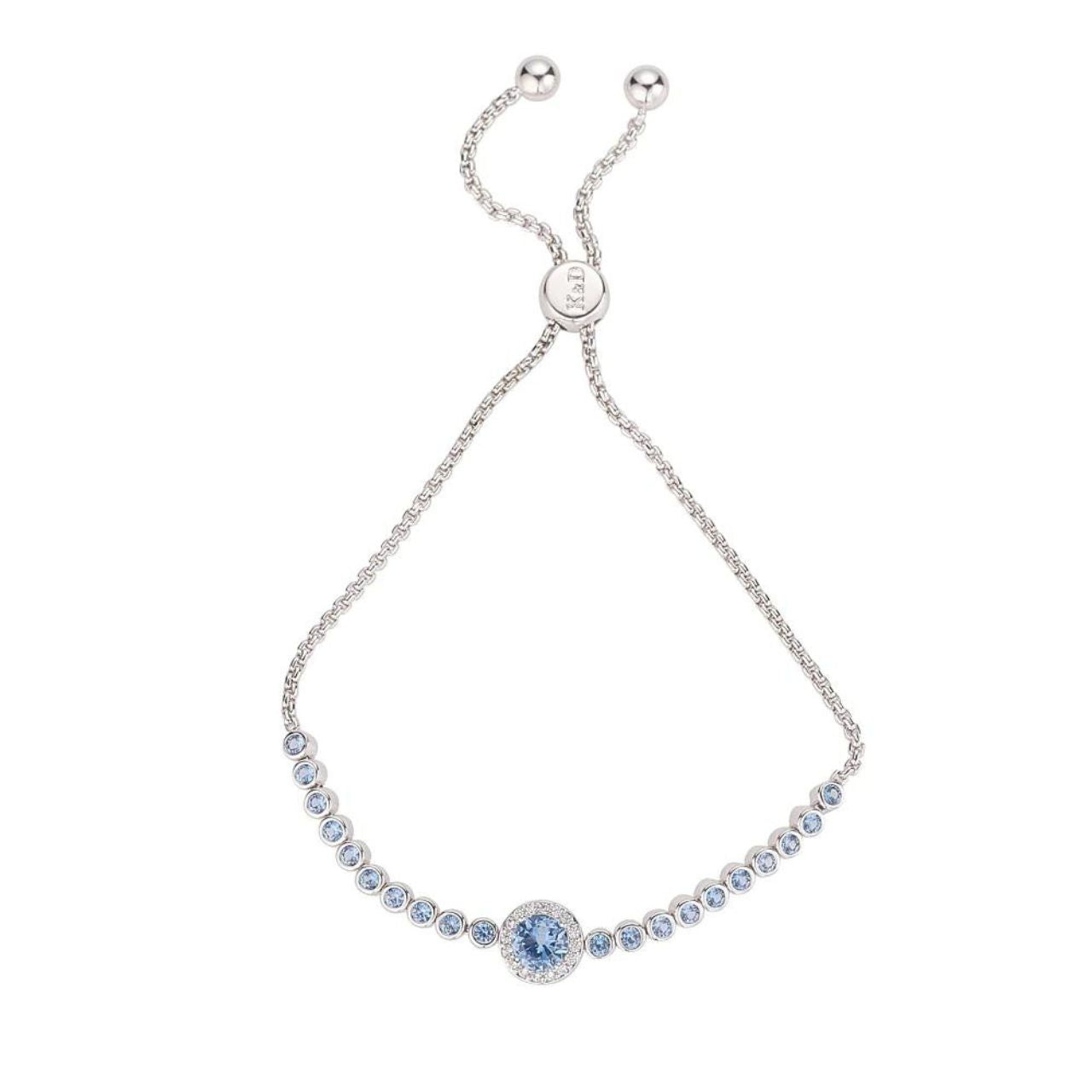 Blue Rhodium Bracelet by Knight & Day Classic style bracelet embellished with light blue CZ stones. Slider fastening. Rhodium plating.