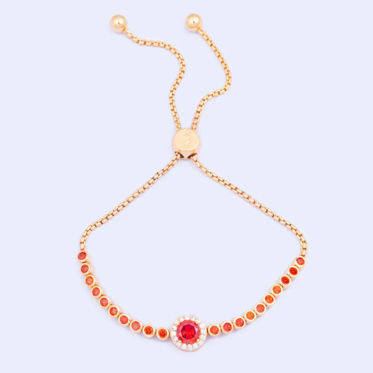 Knight & Day Classic Red Bracelet Classic style bracelet embellished with red CZ stones. Slider fastening. Gold plating.