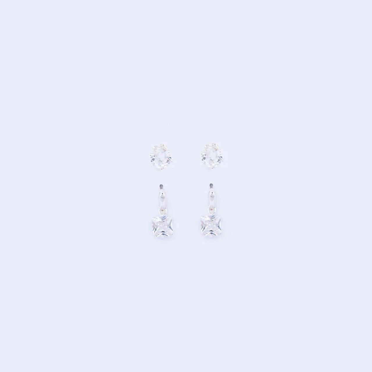 Duo Silver Earring Set by Knight & Day Duo silver earring set, embellished with CZ stones. Ideal for stacking or can be worn separately. Stud fastening. Silver plating.
