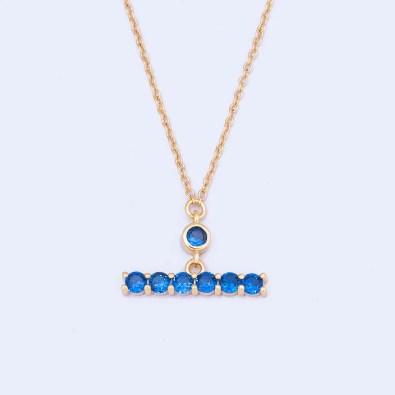 Knight & Day Sapphire T-Bar Necklace T-Bar necklace embellished with sapphire CZ stones. Gold plating.