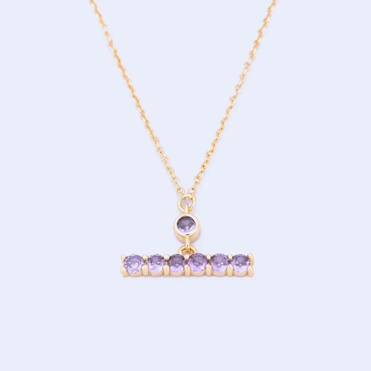 Knight & Day Amethyst T-Bar Necklace T-Bar necklace embellished with amethyst CZ stones. Gold plating. Length 42 + 5cm extension.