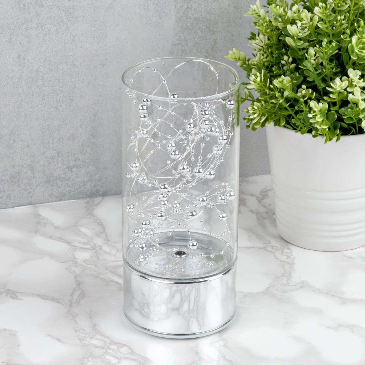 LED Tube Light 20cm Tall Bring some contemporary shimmer to your home with this elegant silver glass light tube. From the Silver Luxe collection by HESTIA® - unparalleled glamour, style and elegance in contemporary home and gift.