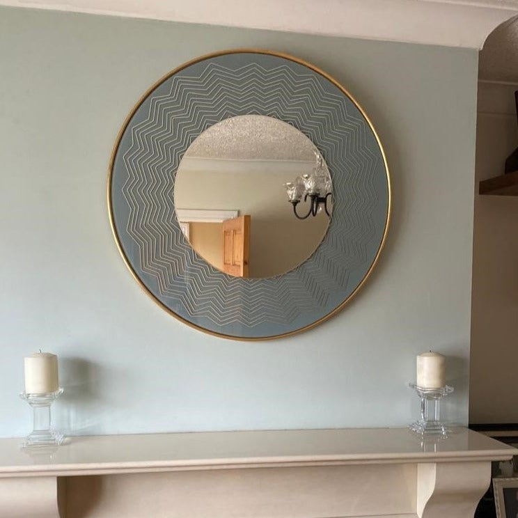 Mindy Brownes Liana Mirror A powder blue mirror! Well that's trendy and fun to add to your home! Miami vibes, stylish round mirror with blue and gold geometric details. Stunning in a bathroom, children's bedroom or hallway for a pop of colour!