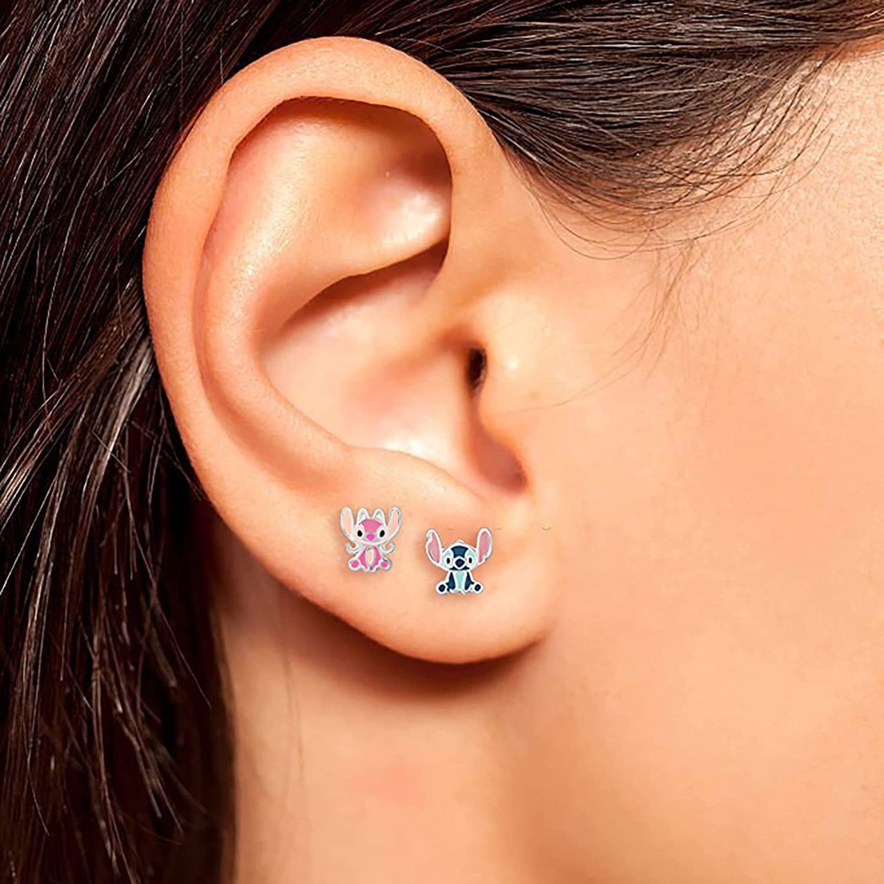 Disney Lilo & Stitch Stud Earrings - Mismatch Angel and Stitch Earrings Disney Lilo & Stitch mismatched earrings include one earring of the naughty, lovable alien Stitch, and one earring of Angel, the songbird alien that Stitch loves.