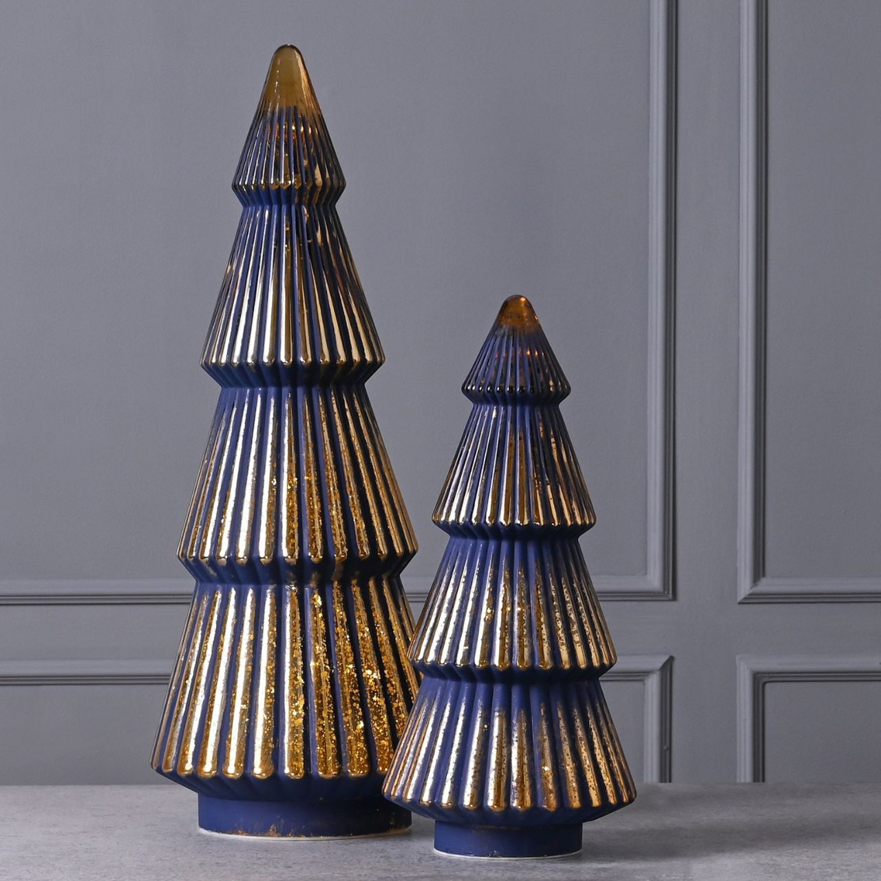 Medium Navy Crackle Glass LED Christmas Tree  A medium navy crackle effect LED Christmas tree.  This vibrant light up ornament makes a delightful addition to homes during the festive period.