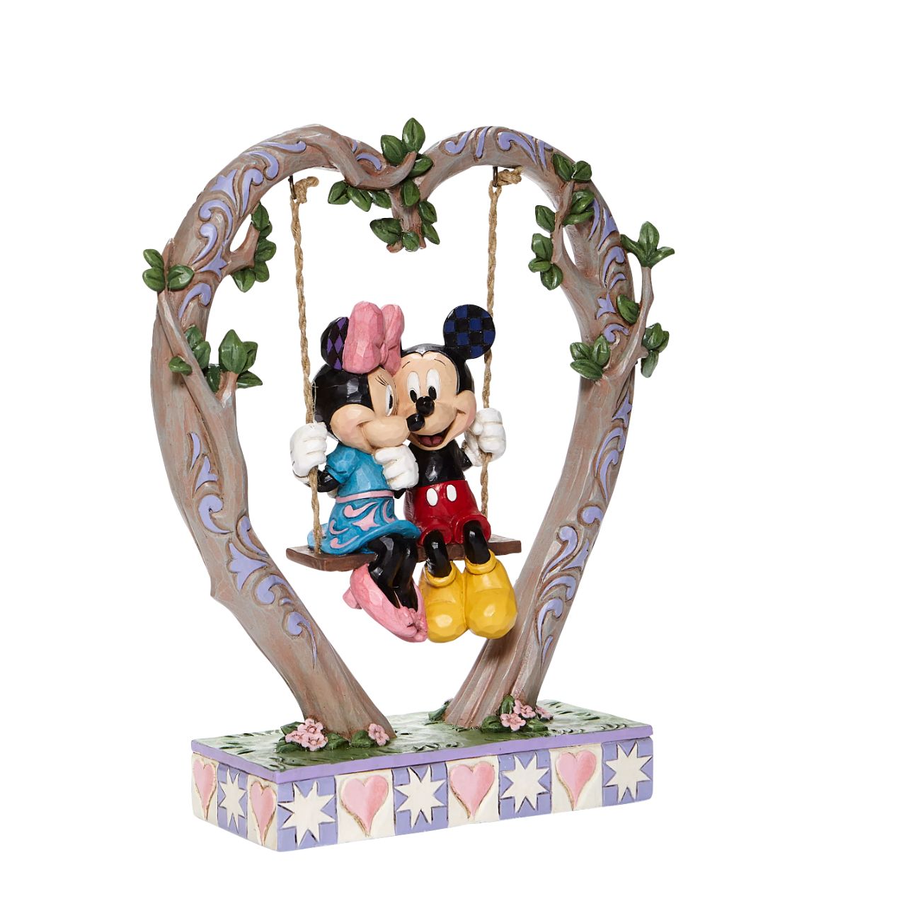Jim Shore Sweethearts in Swing - Mickey and Minnie on Swing Figurine Suspended from a heart-shaped branch, a smitten Mickey and Minnie swing into Spring in this quintessentially romantic Jim Shore sculpture.