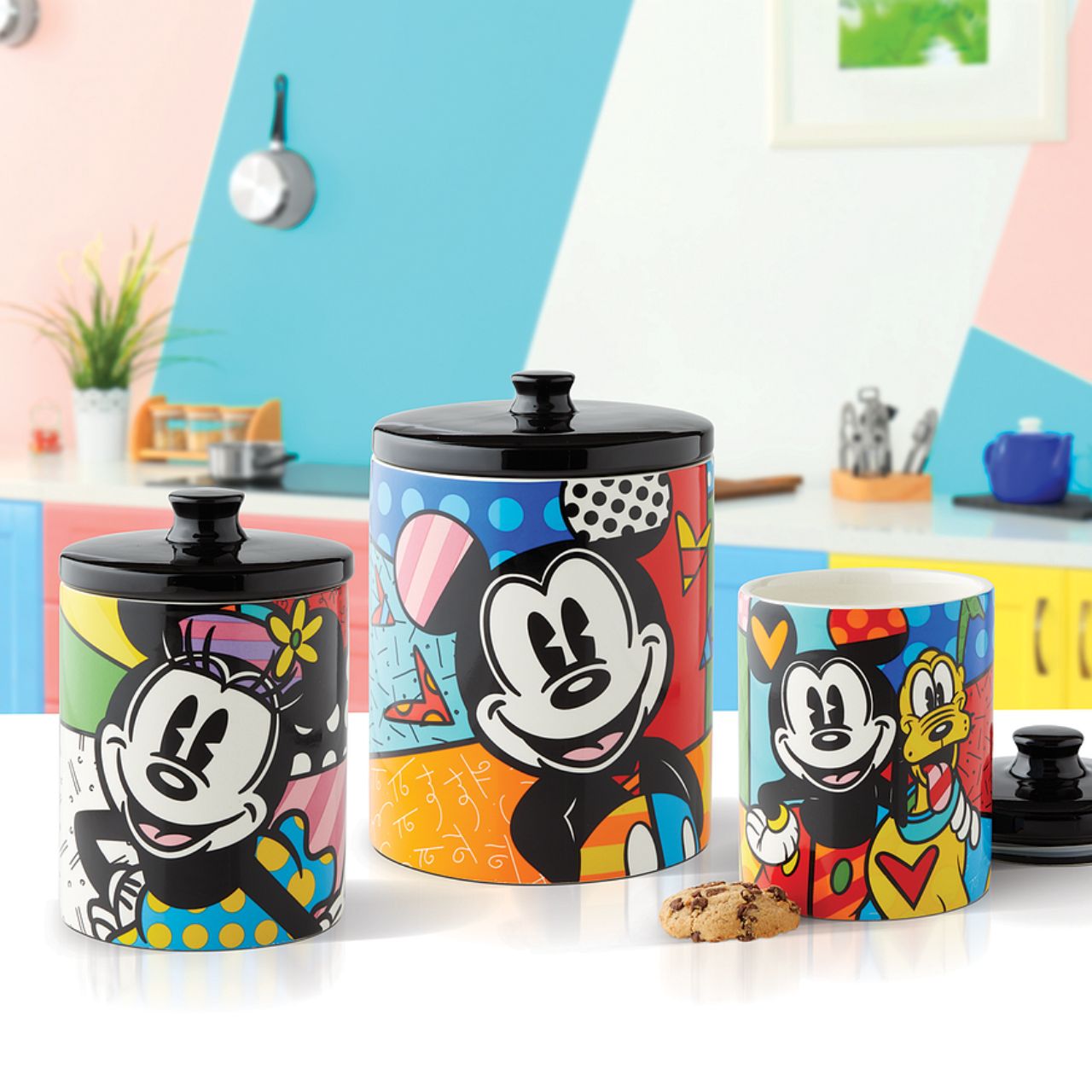 Mickey Mouse and Pluto Cookie Jar Small Mickey Mouse and his best pal Pluto are so full of life and love in this cookie jar canister designed by Romero Britto. Bright, bold, and full of friendship, it will be hard to avoid a sweet treat from such a sweet duo. Perfect for dog treats, coffee, flour, sugar or cookies.