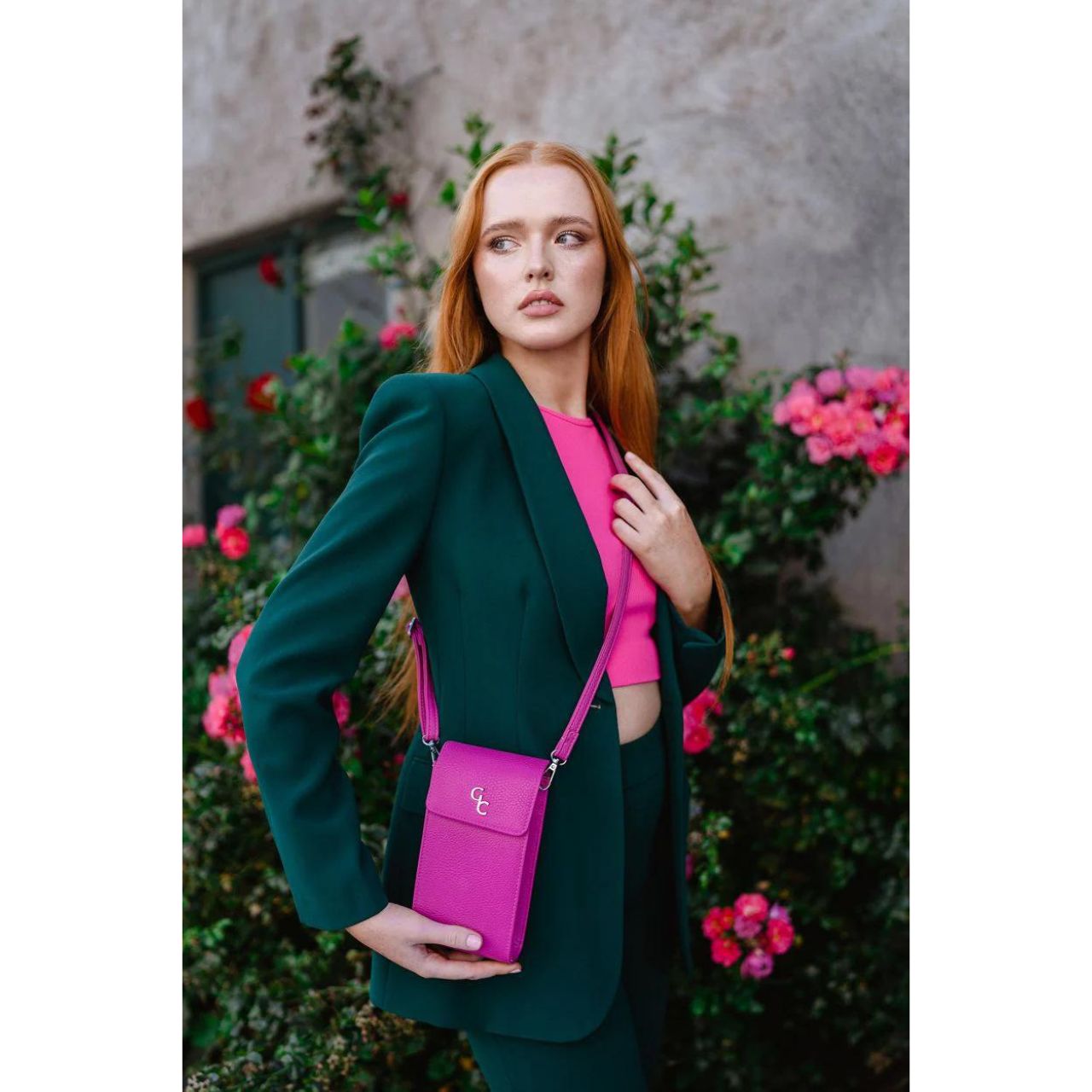 Galway Crystal Mini Cross Body Bag - Cerise Pink Introducing the new must have accessory that is truly functional. Our Light weight, Slim, Sleek, Crossbody bag is designed to hold the most essential accessory: Your mobile phone. There is nothing more liberating than carrying a lightweight bag that carries your essentials.