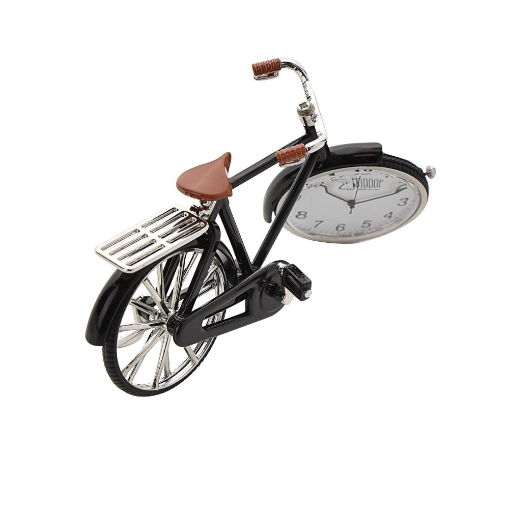 William Widdop Miniature Pedal Bike Quartz Clock Bring a unique and quirky touch to the home with this vintage pedal bike styled miniature clock. Featuring a vintage pedal bike design it will make a great addition to an office or mancave and makes a great gift for a cycling enthusiast.