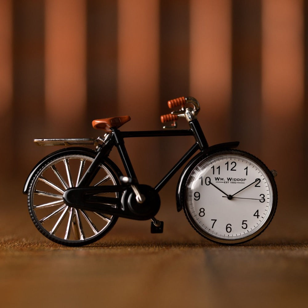 William Widdop Miniature Pedal Bike Quartz Clock Bring a unique and quirky touch to the home with this vintage pedal bike styled miniature clock. Featuring a vintage pedal bike design it will make a great addition to an office or mancave and makes a great gift for a cycling enthusiast.