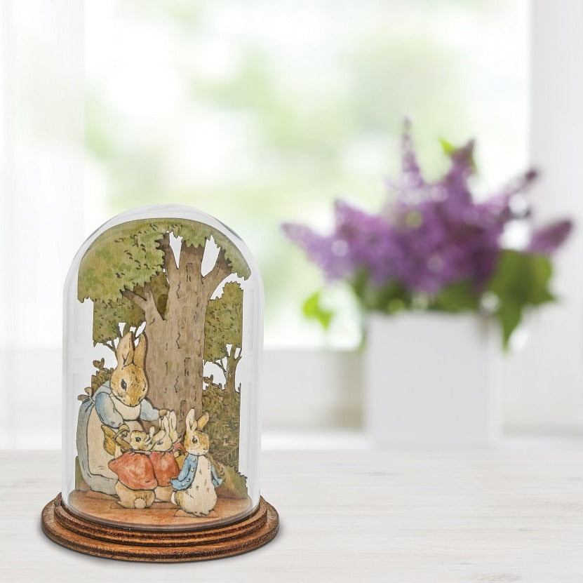 Mrs. Rabbit with Flopsy, Mopsy, Cotton Tail and Peter Wooden This charming Mrs. Rabbit and family wooden figurine has been intricately created and comes encased in a beautiful eco-friendly glass dome.