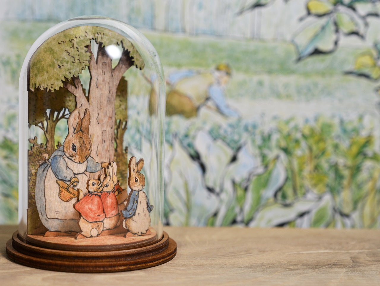 Mrs. Rabbit with Flopsy, Mopsy, Cotton Tail and Peter Wooden This charming Mrs. Rabbit and family wooden figurine has been intricately created and comes encased in a beautiful eco-friendly glass dome.